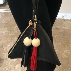 Black pyramid-shaped mini bag